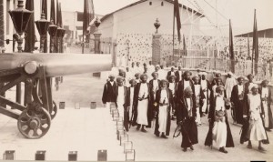 Sultan and other Zanzibari officials walking past cannon, Zanzibar 1905 - Winterton Collection of East African Photographs: 72-3-38