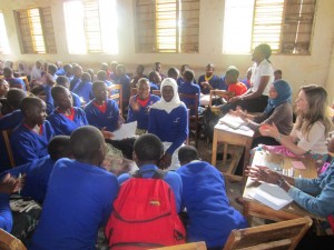 Samia (second from right wearing headscarf) with fellow VSO ICS volunteers Flora John Moshi and Catriona Mckayand at a sexual and reproductive health session at Rutabo Secondary School 